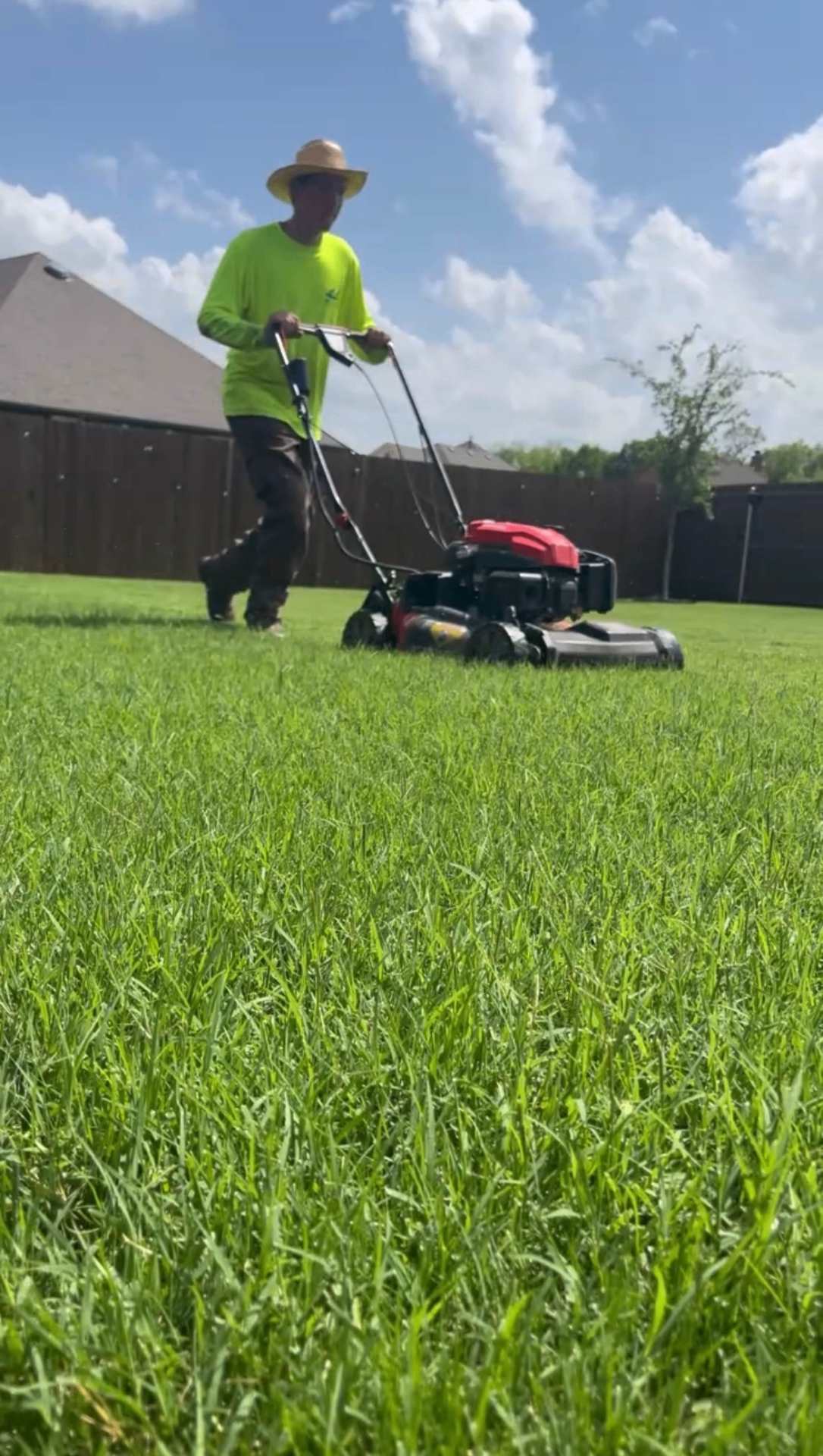 The Michael's Mowing crew at work in a Fort Worth yard